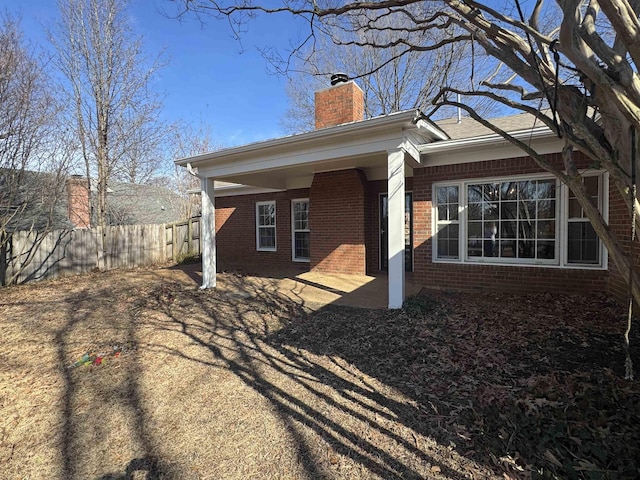 view of side of home with a patio area