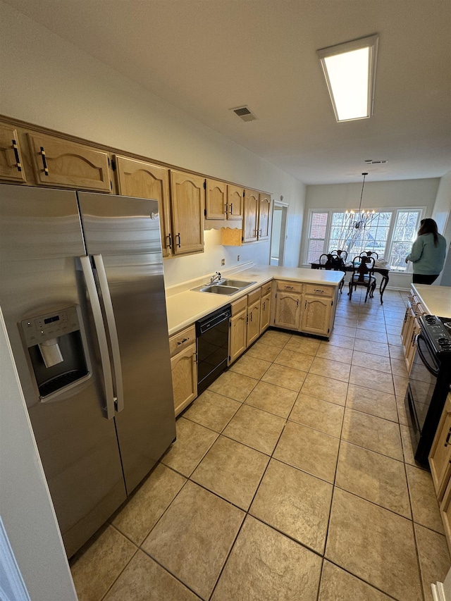 kitchen featuring hanging light fixtures, light brown cabinets, light tile patterned floors, kitchen peninsula, and black appliances