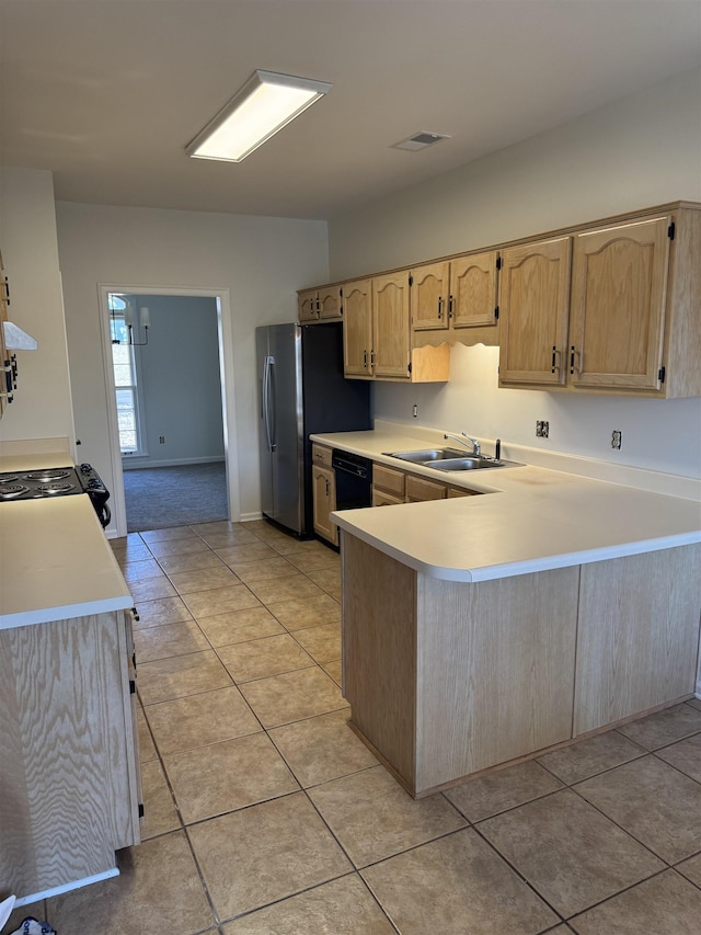 kitchen with light tile patterned floors, kitchen peninsula, sink, and light brown cabinets