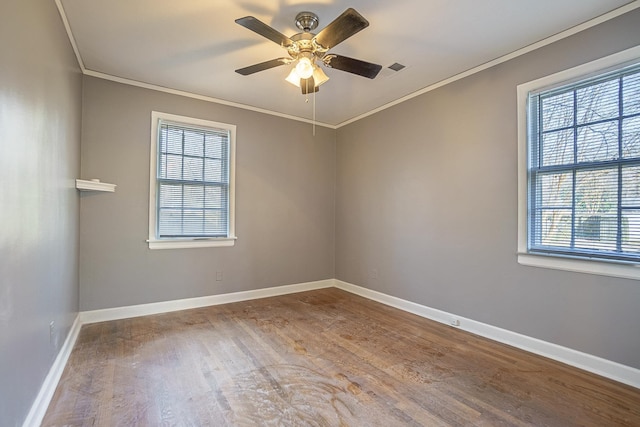 unfurnished room featuring crown molding, hardwood / wood-style floors, and ceiling fan