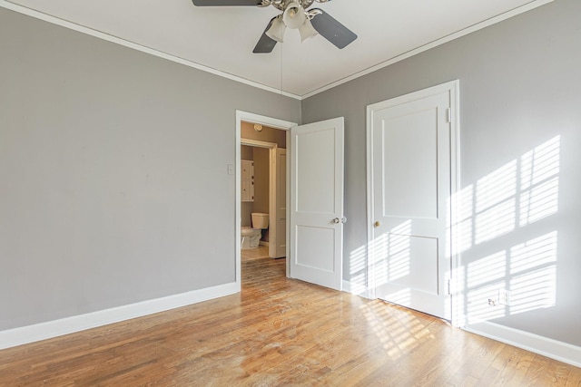 unfurnished room featuring ceiling fan, ornamental molding, and light hardwood / wood-style flooring