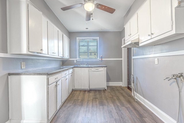 kitchen featuring dark wood-type flooring, sink, white cabinets, and white dishwasher