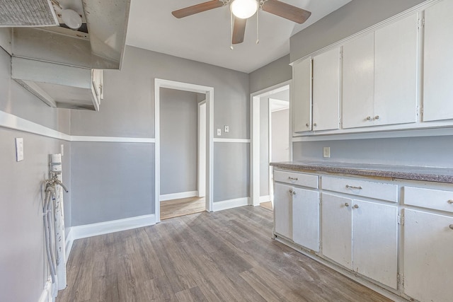 kitchen with white cabinetry, light hardwood / wood-style flooring, and ceiling fan