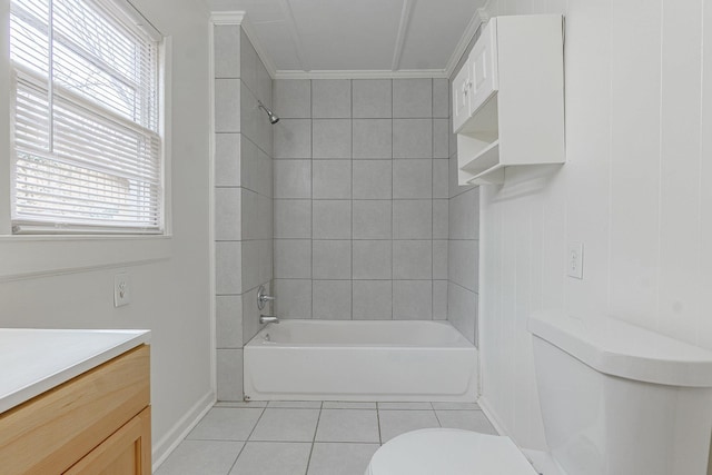 full bathroom with tile patterned flooring, vanity, tiled shower / bath combo, and toilet