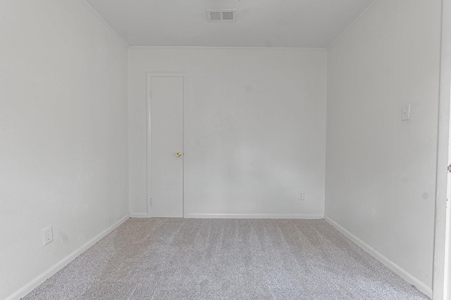 unfurnished room with carpet floors and ornamental molding