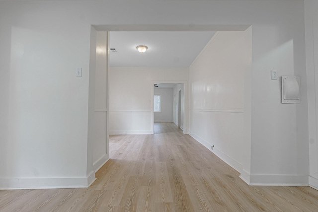 corridor with light hardwood / wood-style flooring