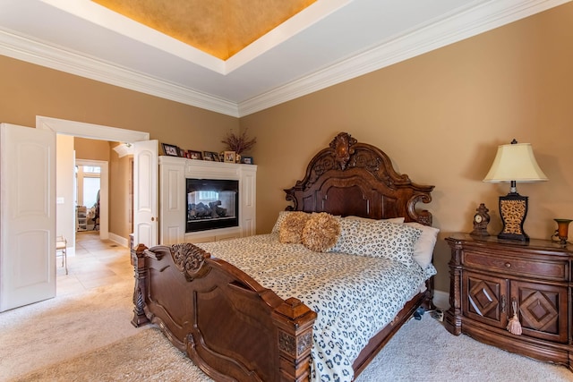 bedroom featuring crown molding, a multi sided fireplace, a raised ceiling, and light carpet