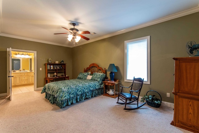 bedroom featuring ornamental molding, light carpet, ceiling fan, and ensuite bathroom