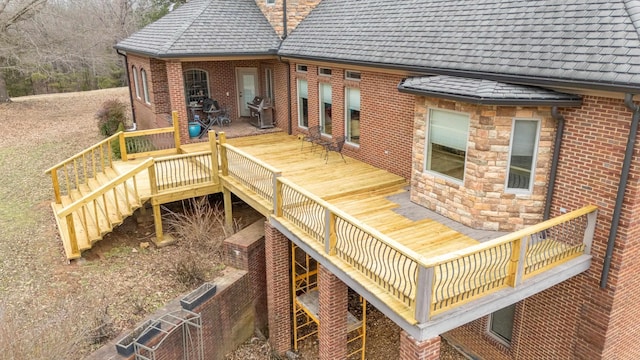 wooden terrace with area for grilling