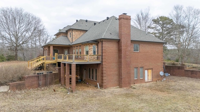 back of property featuring a wooden deck