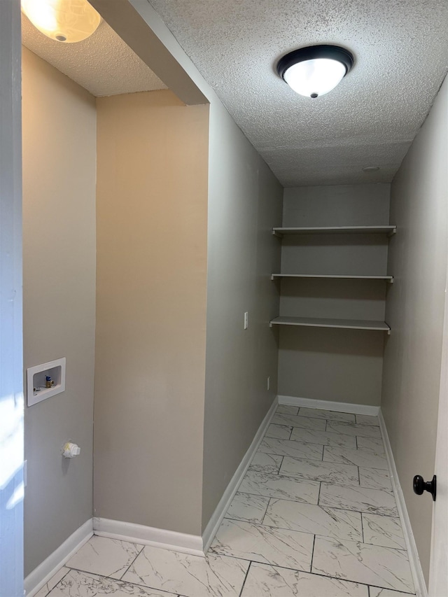 interior space with a textured ceiling