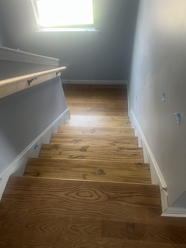 153 Caldwell Ave, Memphis, TN 38107 - stairs featuring wood finished floors and baseboards