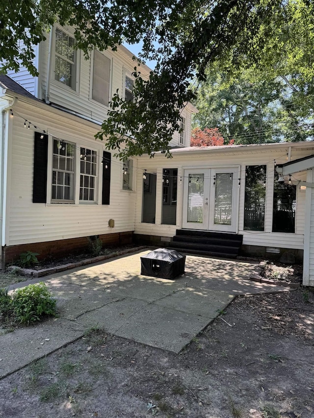 property entrance featuring french doors and a patio area