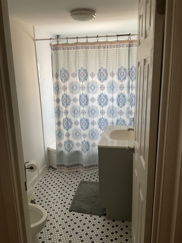 full bathroom with shower / tub combo with curtain, vanity, toilet, and tile patterned flooring