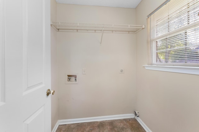 washroom featuring hookup for an electric dryer, washer hookup, and a textured ceiling