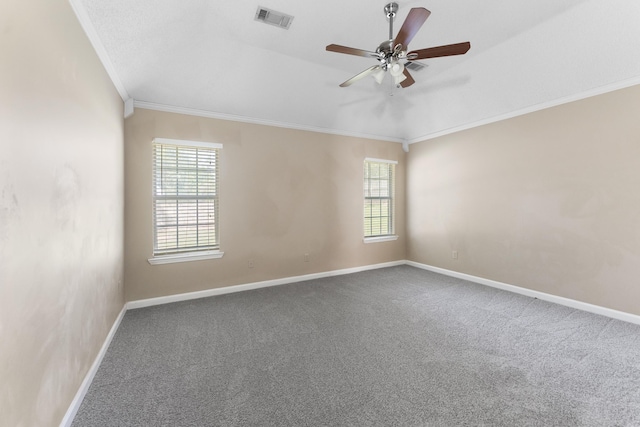 carpeted spare room featuring ceiling fan and ornamental molding