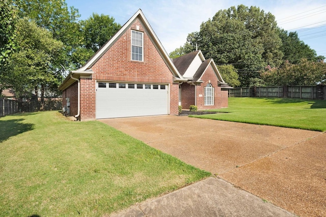 view of front of home featuring a garage and a front lawn