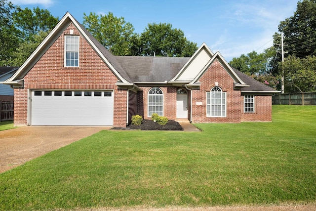 view of front of house with a garage and a front lawn