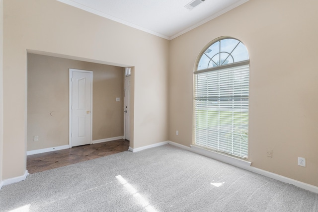 carpeted empty room with crown molding