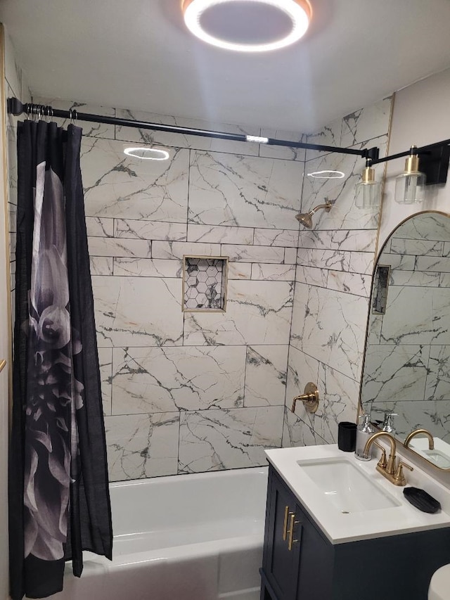 bathroom with vanity, shower / bathtub combination with curtain, and tile walls