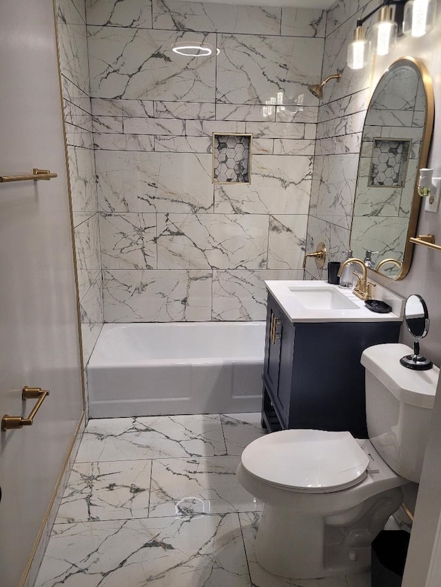 full bathroom featuring tiled shower / bath combo, vanity, and toilet