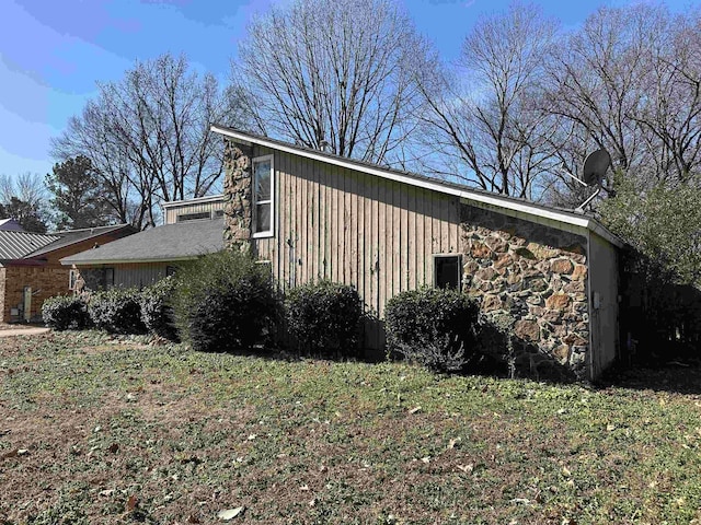 view of home's exterior with a yard