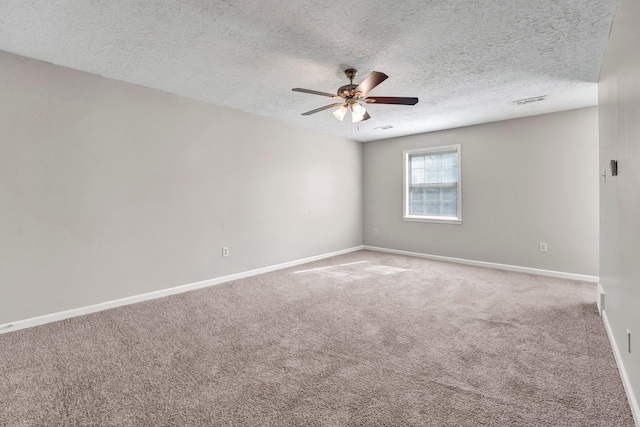 unfurnished room featuring carpet flooring, a textured ceiling, and ceiling fan