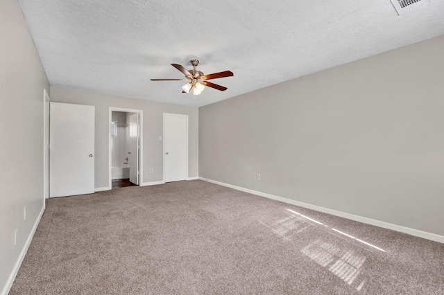 unfurnished bedroom with ceiling fan, carpet floors, and a textured ceiling