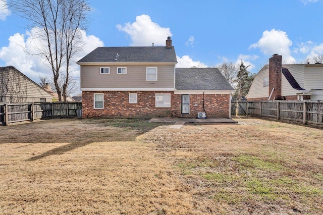 back of house with a yard