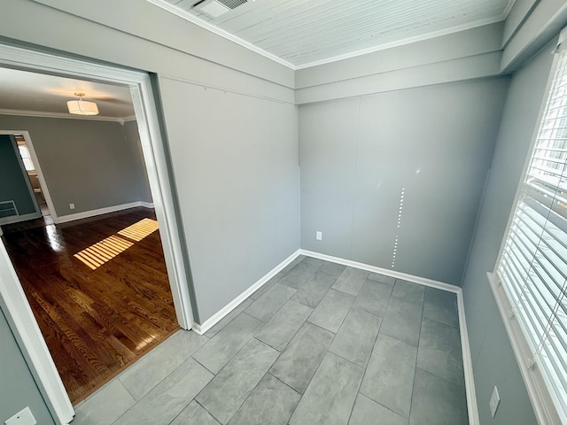 unfurnished room with hardwood / wood-style floors and ornamental molding