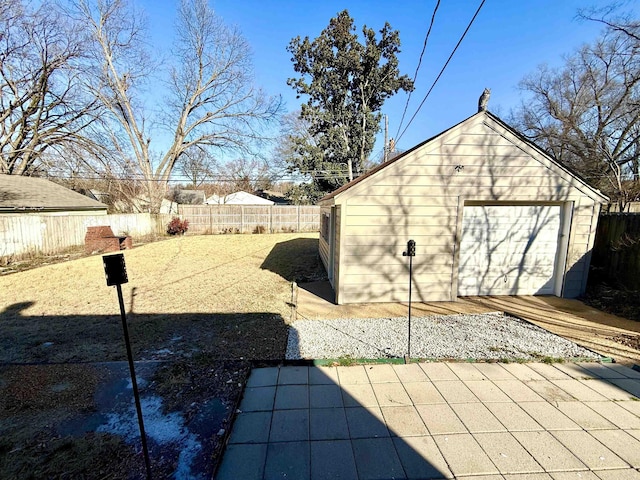 view of yard with an outbuilding and a garage