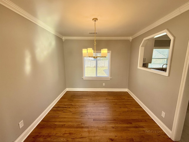 unfurnished dining area with crown molding, an inviting chandelier, and dark hardwood / wood-style flooring