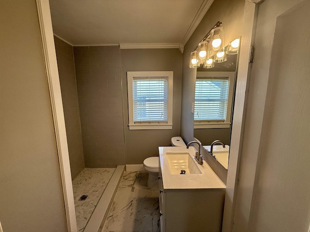 bathroom with ornamental molding, a tile shower, vanity, and toilet