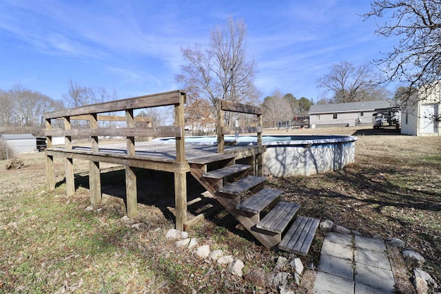 wooden terrace with a covered pool