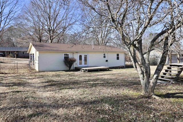 back of house featuring french doors and a deck