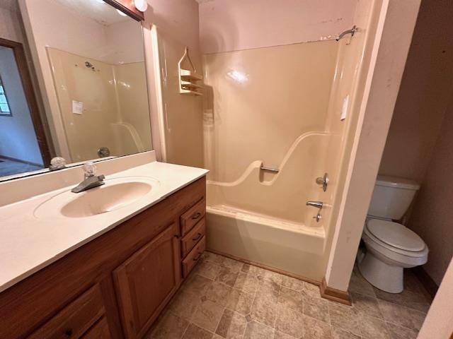 full bathroom with shower / tub combination, vanity, and toilet