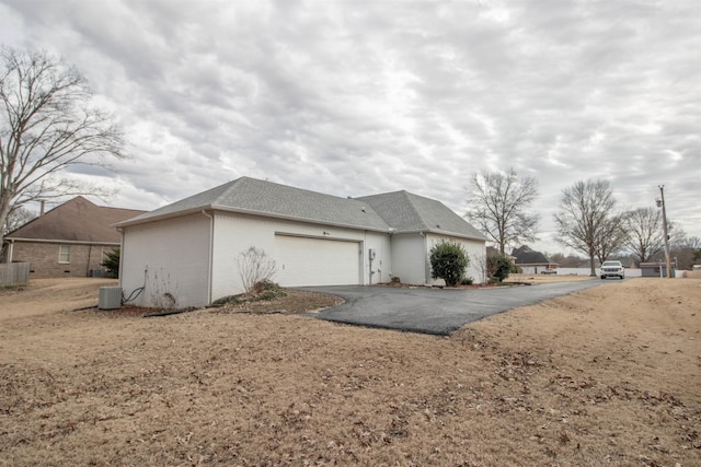 view of side of home featuring a garage