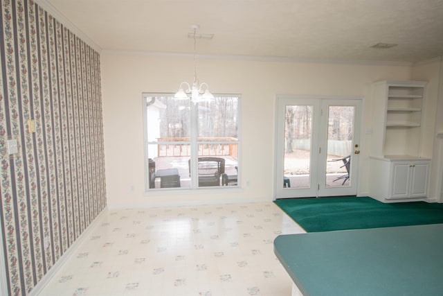 interior space with crown molding and an inviting chandelier