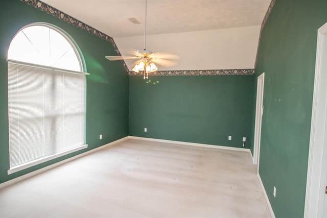 carpeted spare room with ceiling fan