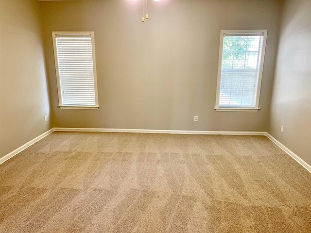 unfurnished room featuring carpet