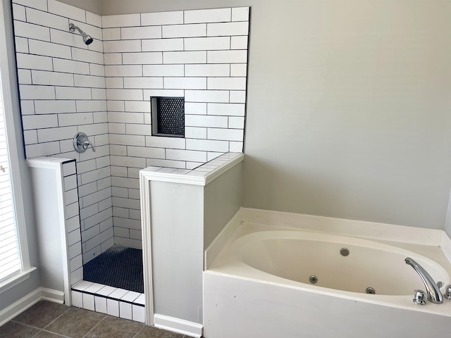 bathroom featuring independent shower and bath and tile patterned flooring