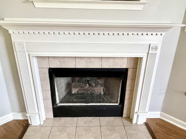 interior details featuring wood-type flooring and a fireplace