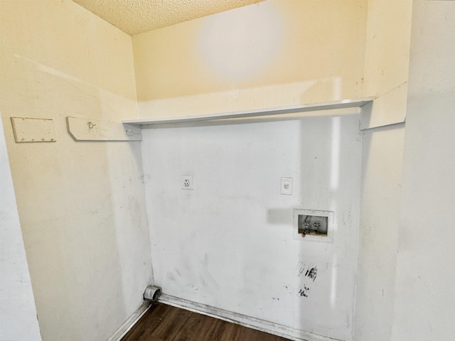 laundry area with hookup for an electric dryer, dark wood-style floors, a textured ceiling, washer hookup, and laundry area
