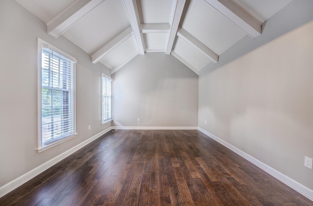 additional living space featuring vaulted ceiling with beams and dark wood-type flooring