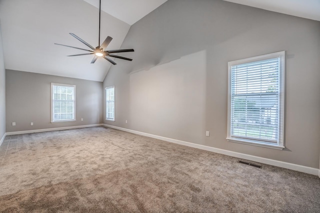 unfurnished room with high vaulted ceiling, ceiling fan, and carpet