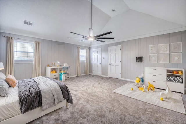 bedroom featuring ceiling fan, lofted ceiling, carpet flooring, and multiple windows