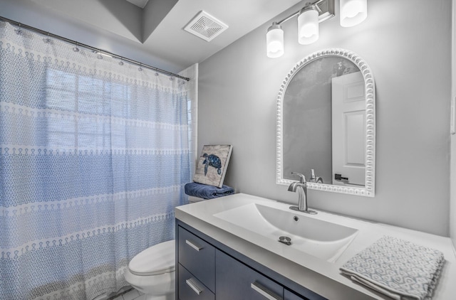 bathroom with vanity, toilet, and a shower with shower curtain