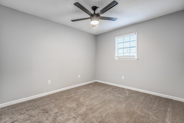 empty room featuring carpet flooring, a textured ceiling, and ceiling fan