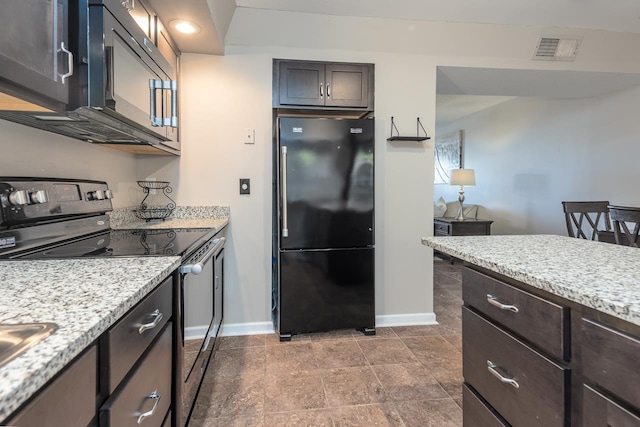 kitchen with dark brown cabinetry, light stone countertops, and black appliances