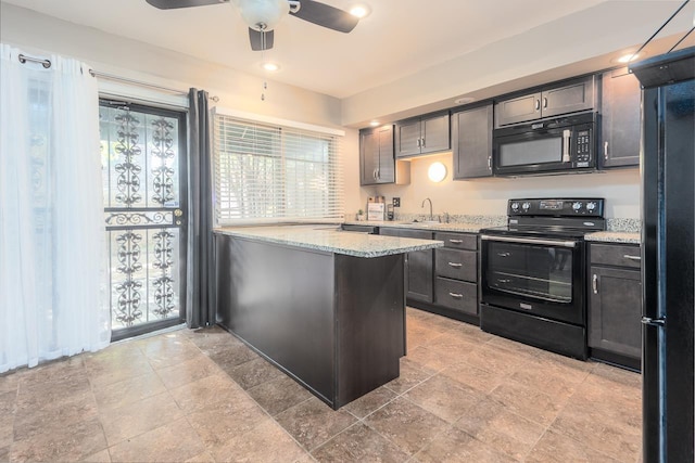 kitchen featuring black appliances, sink, ceiling fan, kitchen peninsula, and light stone counters